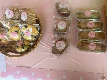 Packaged treats on a pink table